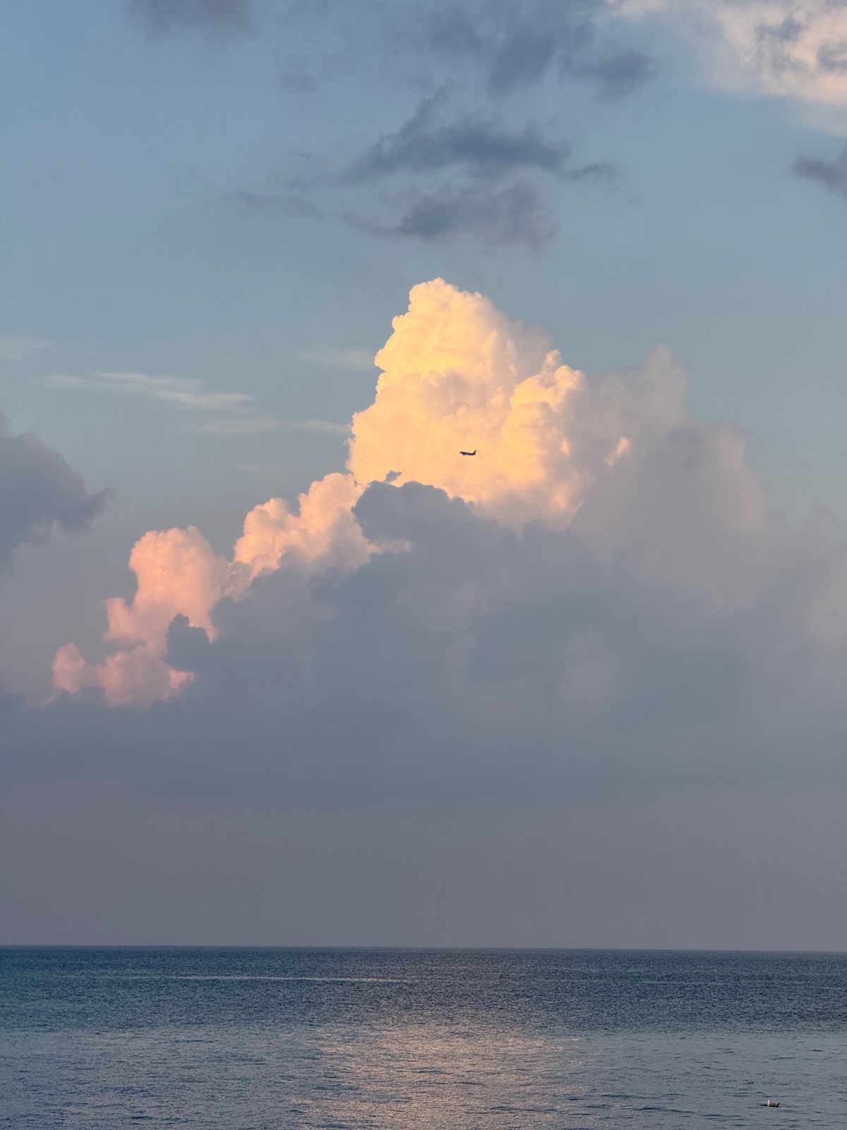 A plane crossing the cloud bank
